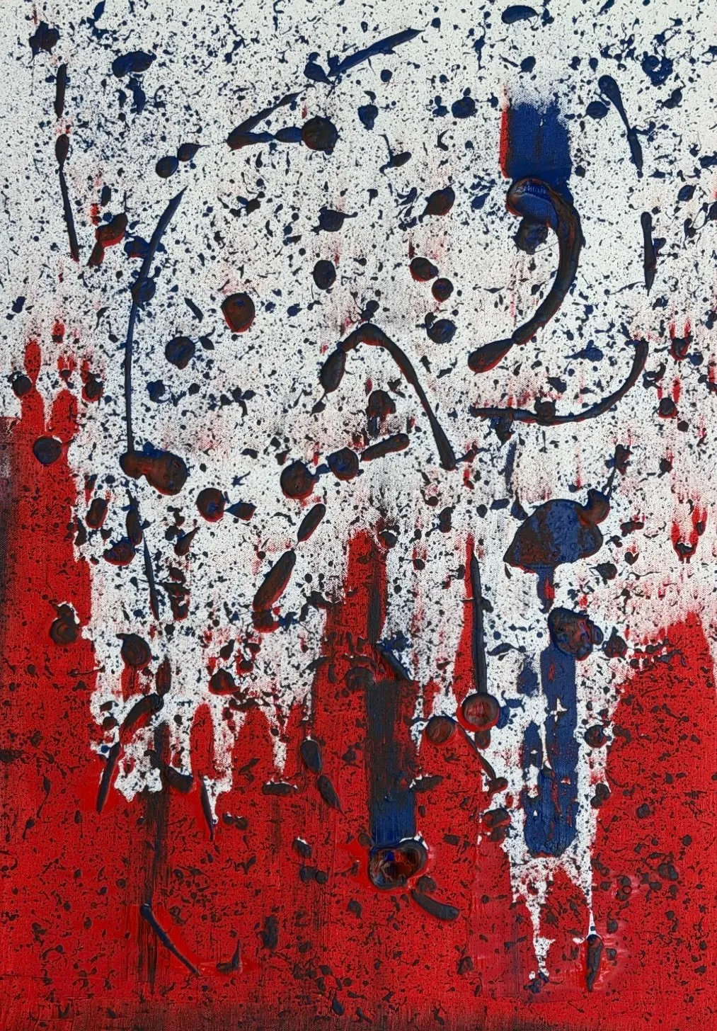 Navy blue drips and splatter over a white upper half and a vermilion lower half.
