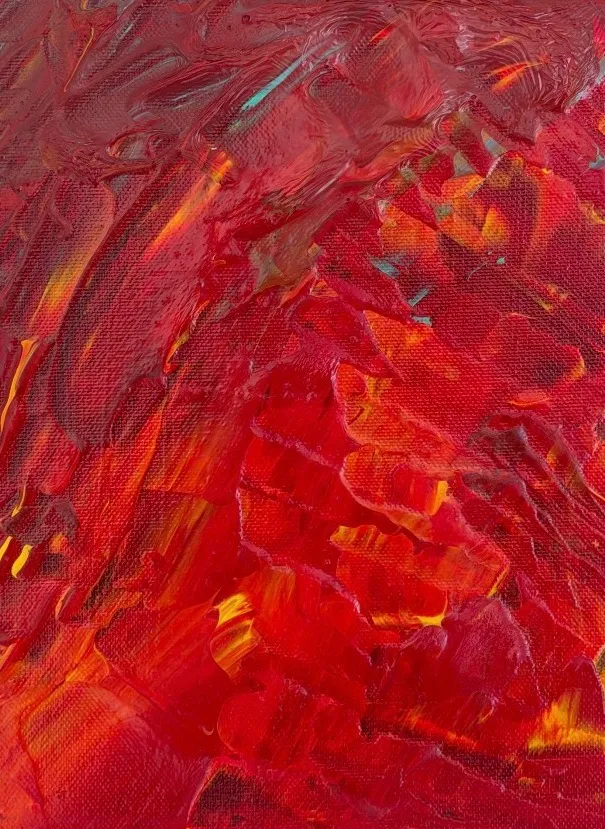 Thick red, orange and yellow impasto with small flashes of turquoise.